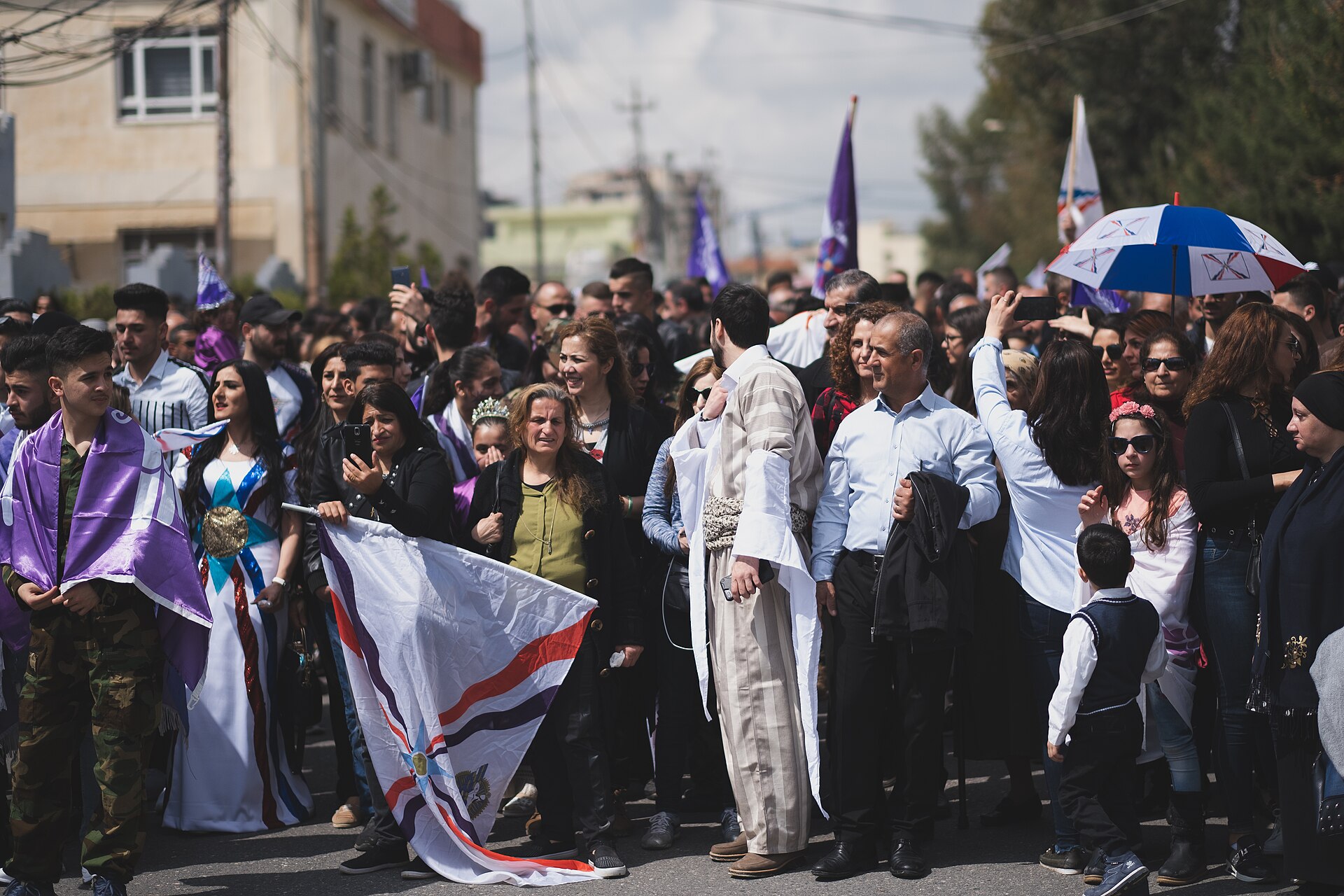 Assyrians in bright traditional dress parading at the Akitu New Year festival in Duhok