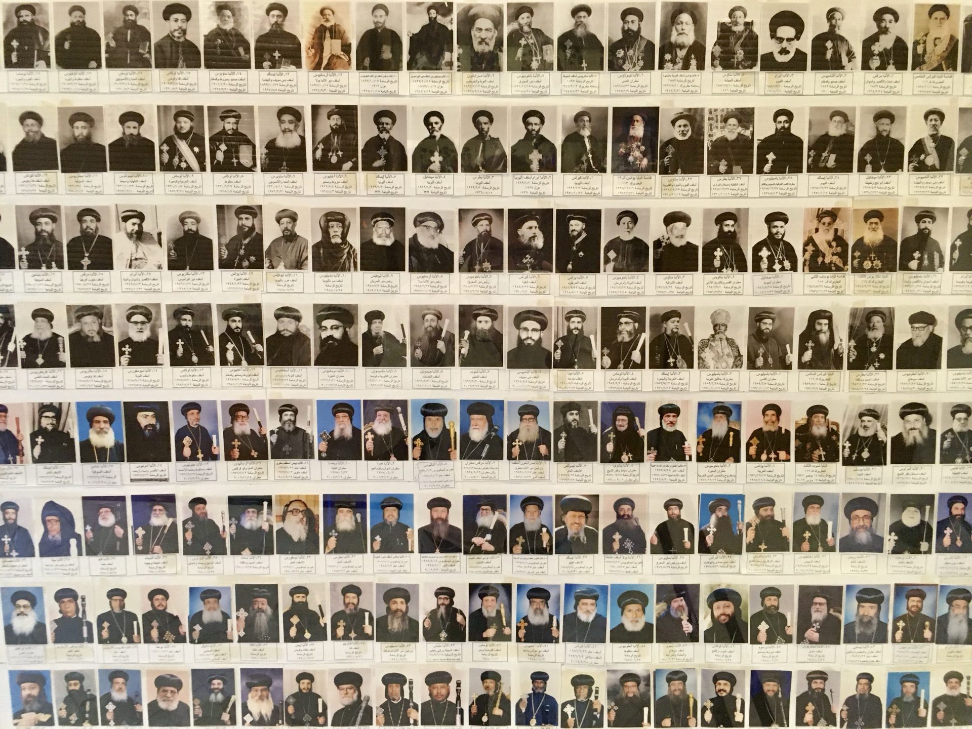 Portraits of Coptic patriarchs displayed in a church gallery