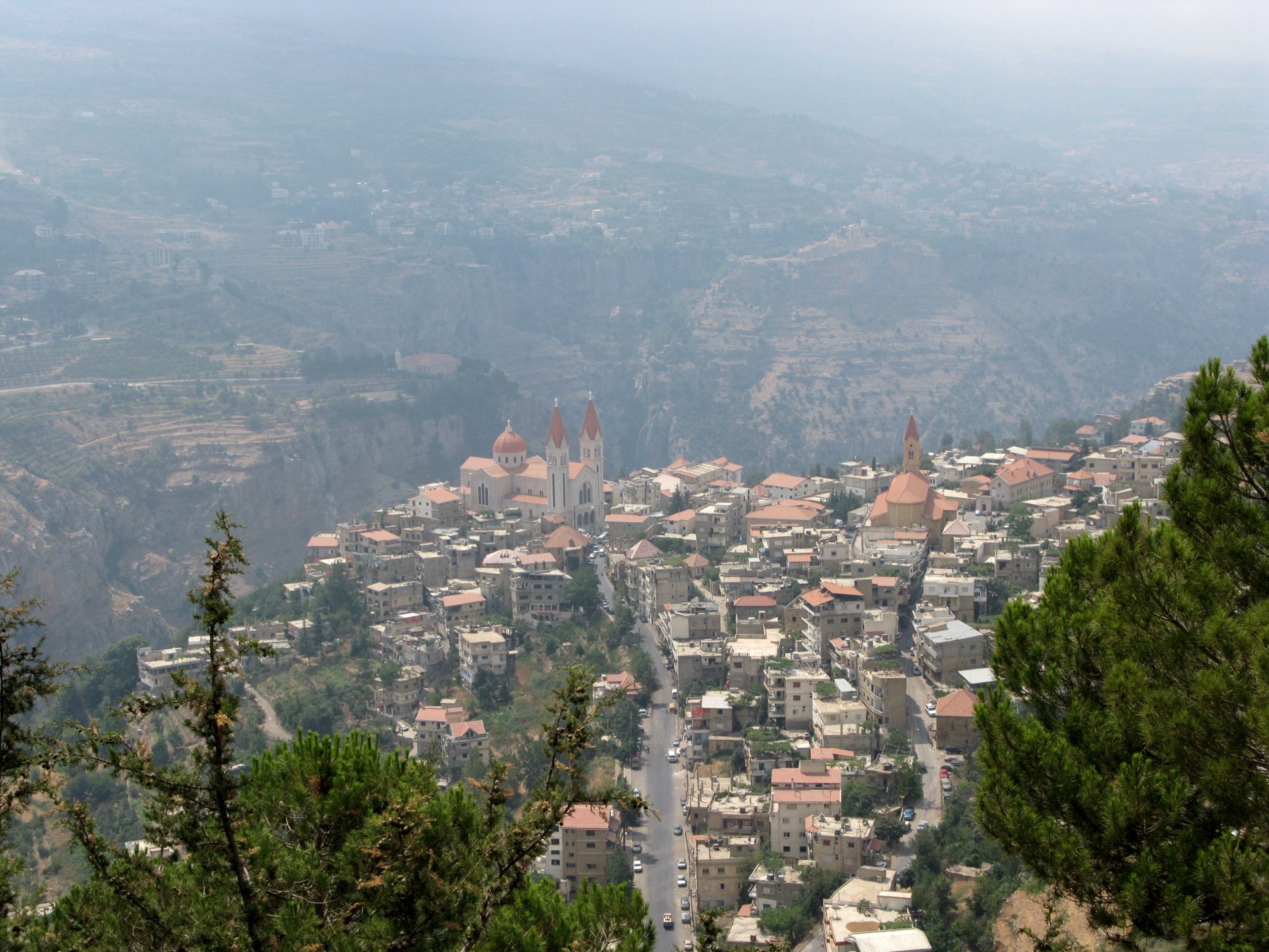The red-roofed town of Bsharri on the rim of the Qadisha gorge under Mount Lebanon