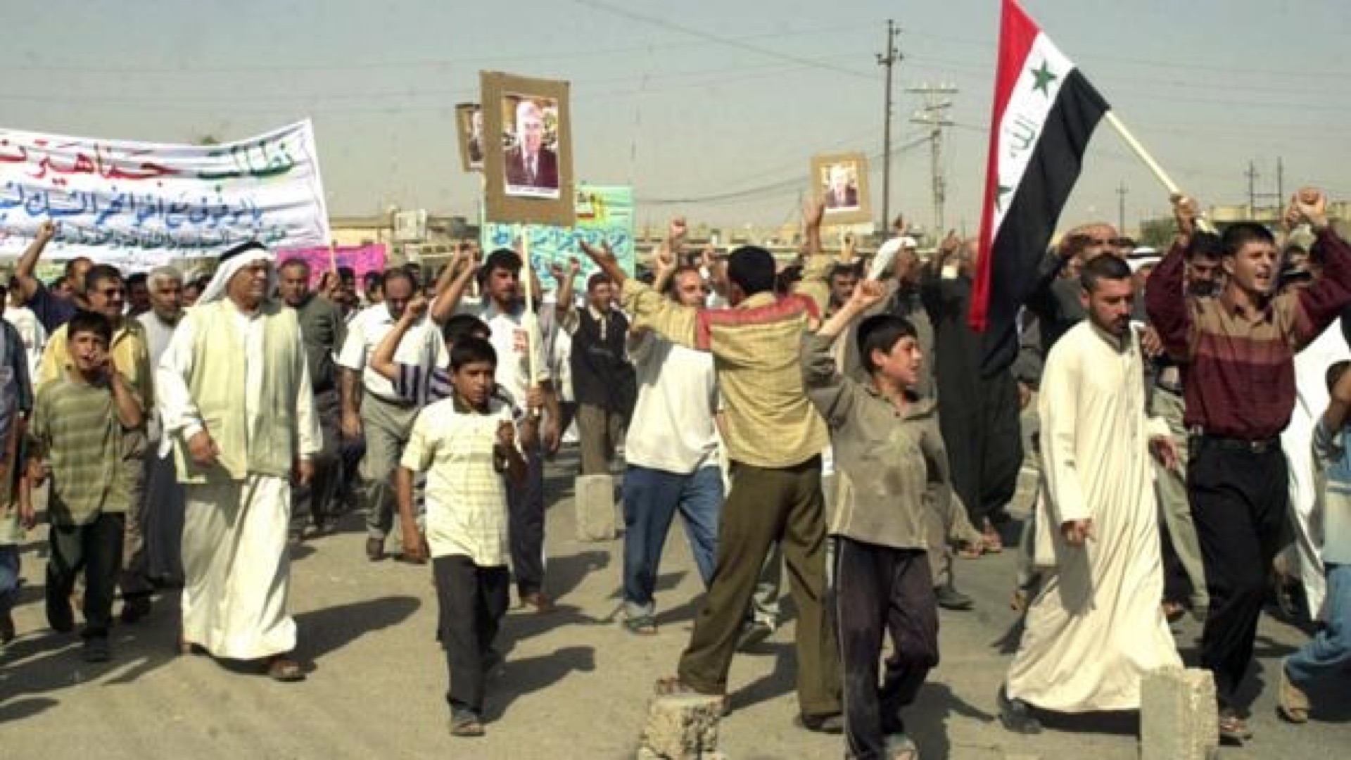 Shabak demonstrators with banners at a rally in Iraq