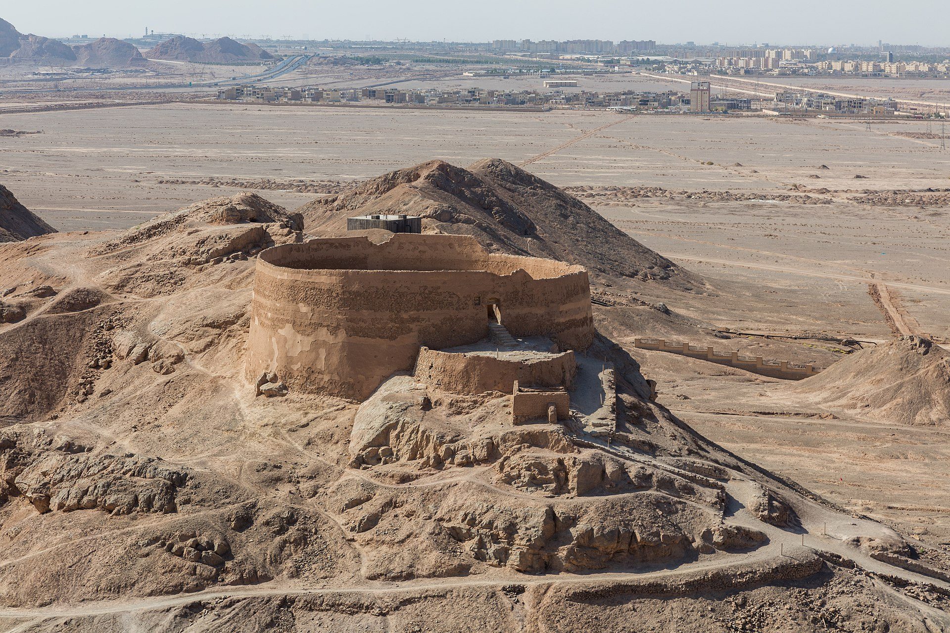 The circular Tower of Silence on its barren hill outside Yazd